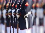 Military servicemen holding bayonets